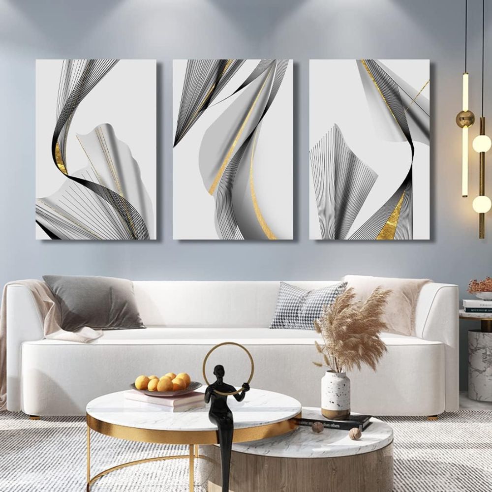 Modern living room with abstract wall art above a white sofa.